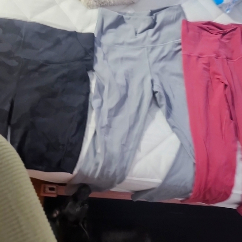 lululemon- 3 Pairs, 2 Leggings Size 8. One Biker Shorts Size 10.